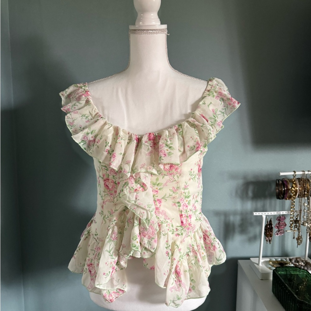 Trendy boutique Cream Floral Ruffle Peplum Camisole with Pink Accents